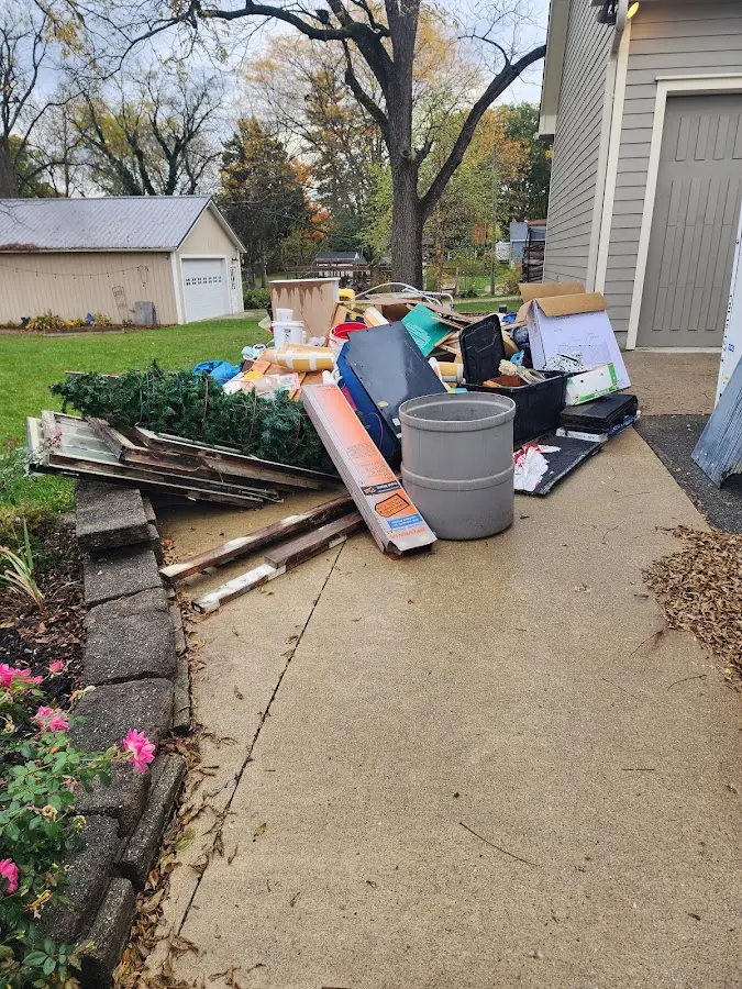 Dumpster being loaded with debris for Roofing Dumpster Rental in Blue Ridge